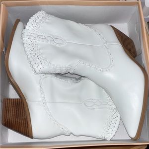 White boutique style cowgirl booties with trim